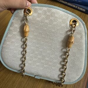 Vintage monogram Gucci bag in light blue with bamboo and gold shoulder strap